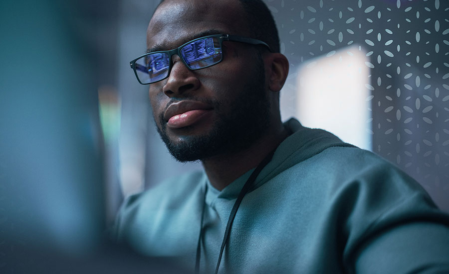 Composite of school supplies (pencils, pencil sharpener, stapler, eraser, etc.) and a keyboard.
