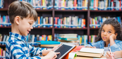 Student reading in library